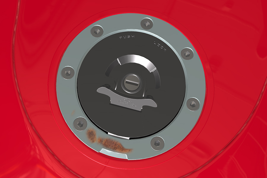 Motorcycle fuel tank cap with rust defect Motorcycle fuel tank cap with rust defect